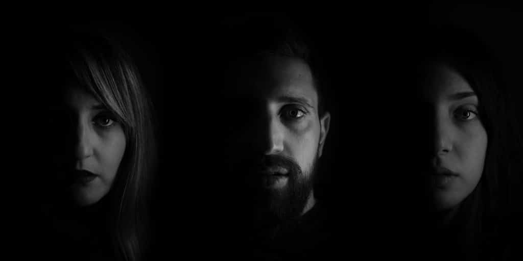 portrait of three people in gray scale