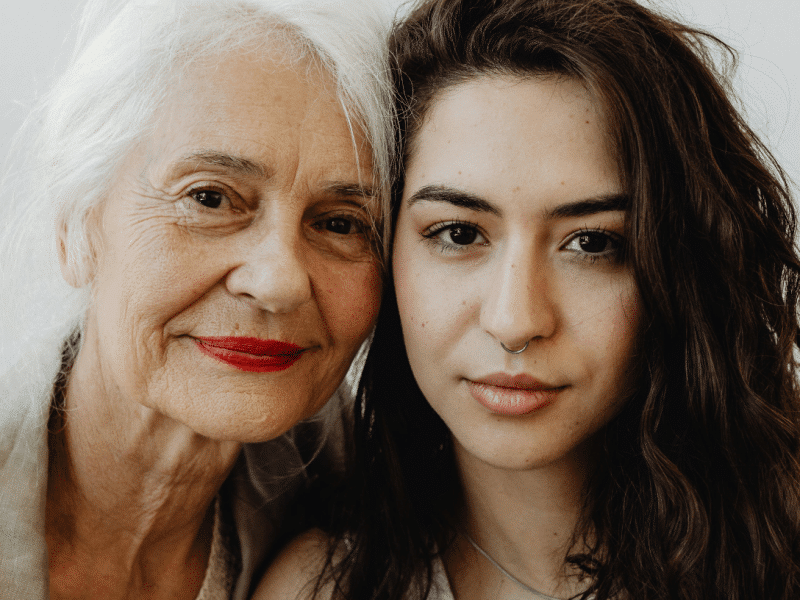 grandmother and granddaughter side by side