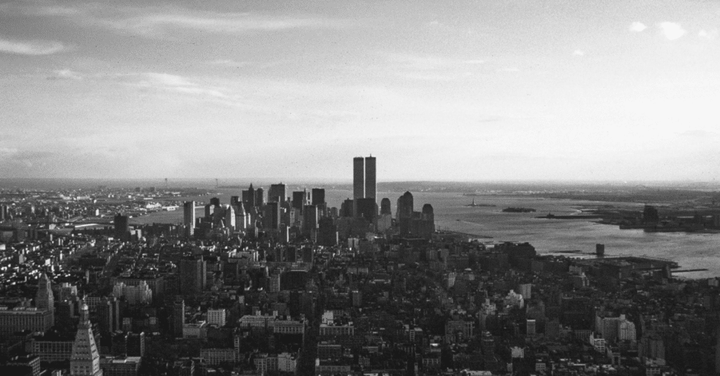 black and white photo of new york skyline with twin towers