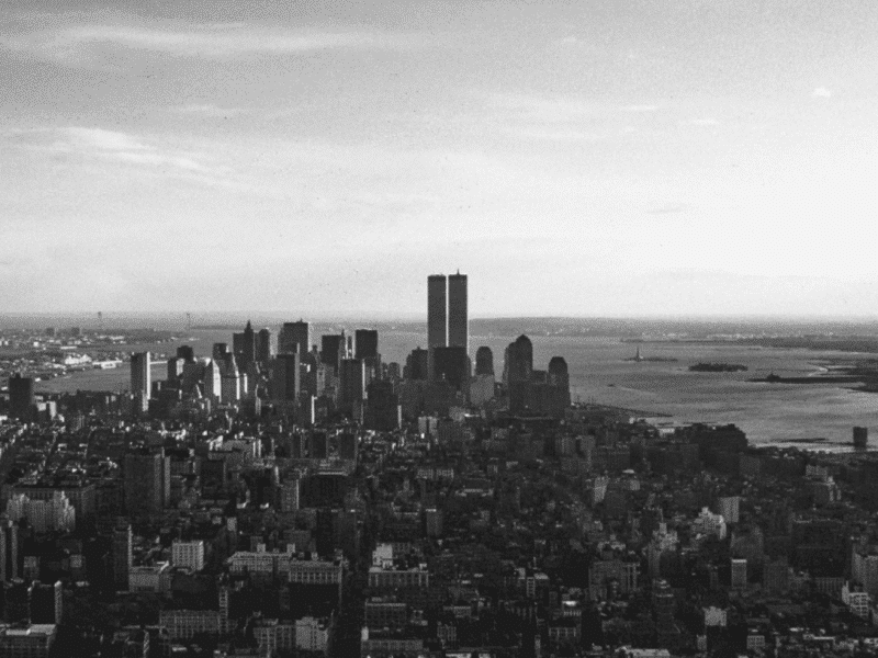 black and white photo of new york skyline including twin towers