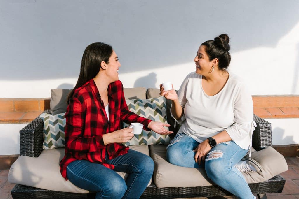 two friends chatting over coffee
