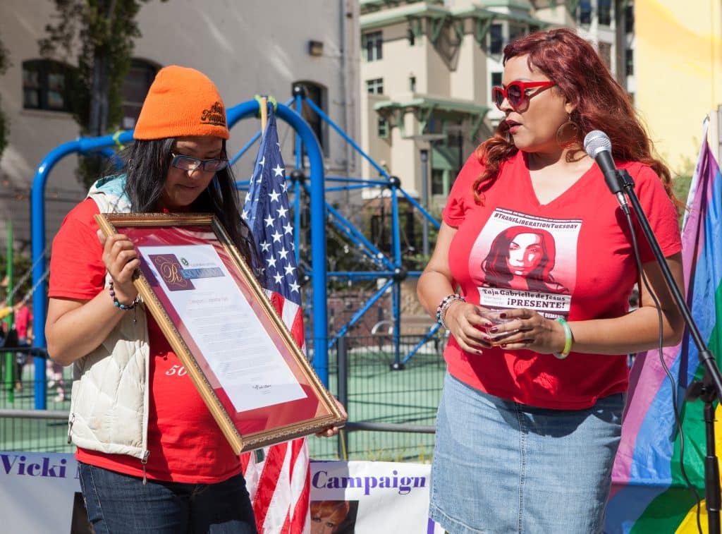 Activists Gwen Park and Dani Castro read a resolution from state senator Mark Leno during a celebration of the 50th anniversary of the Compton's Cafeteria Riot.