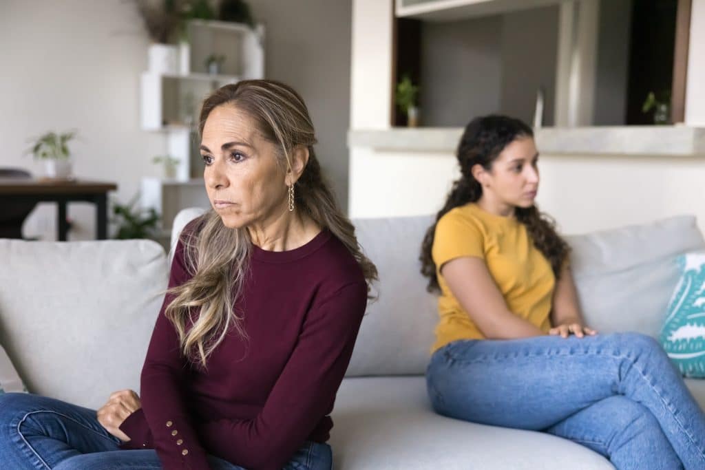 mother and daughter looking upset