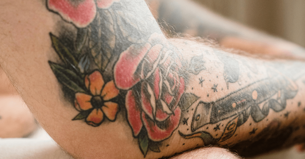 close up of rose tattoo on arm