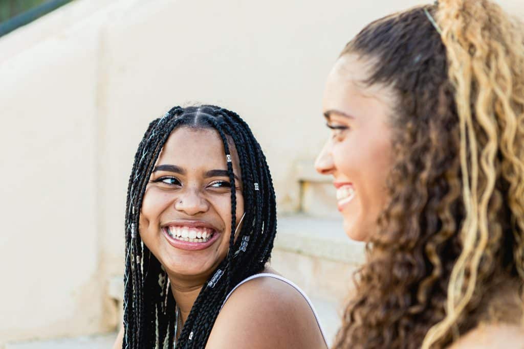 two women laughing together