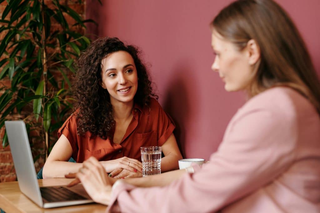 woman smiling to friend