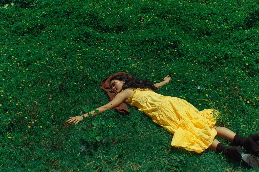 woman laying on grass