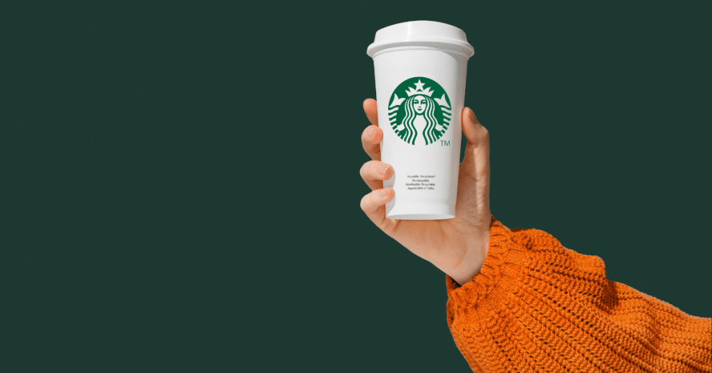 hand holding a starbucks cup