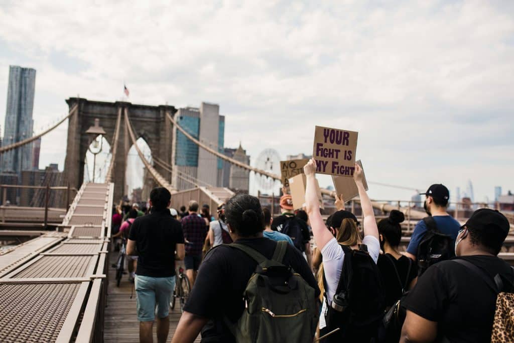 protestors holding up signs