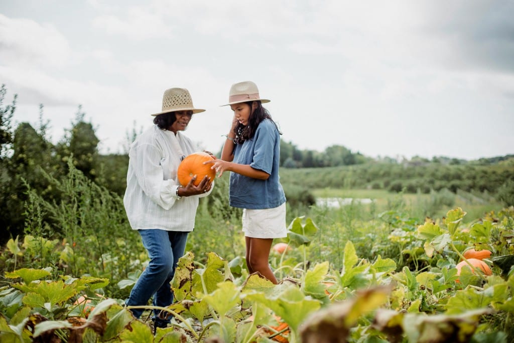 mother and daughter picking a pumpkin