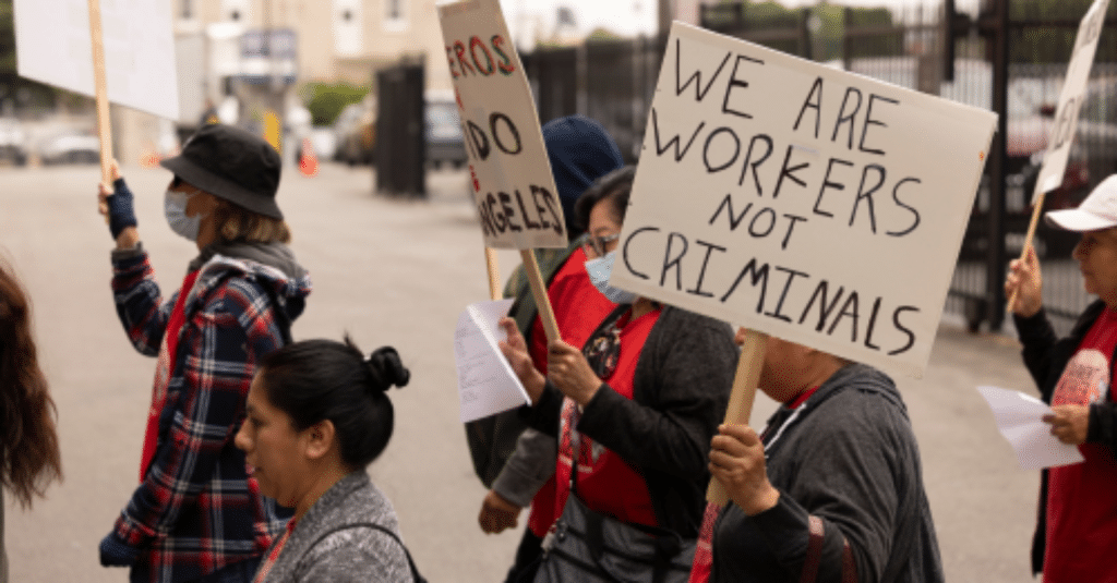 protestor holding sign in a protest on the street