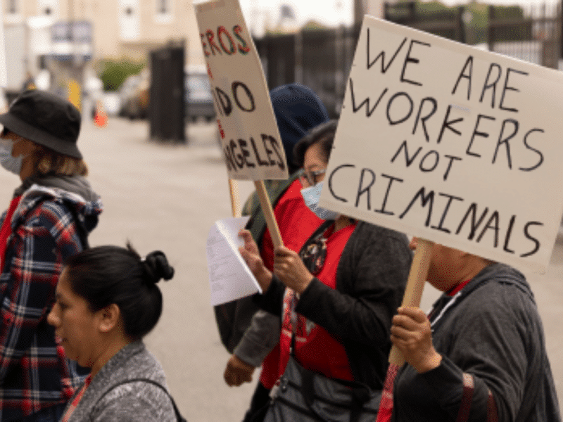 protestor holding sign in a protest on the street