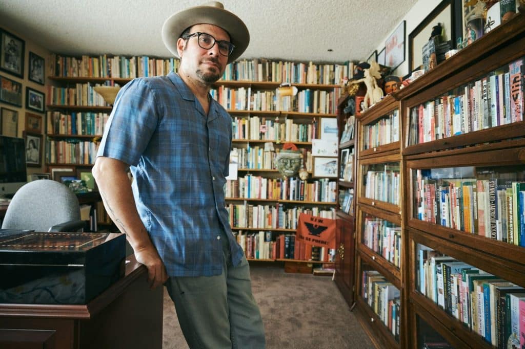 man leaning against desk
