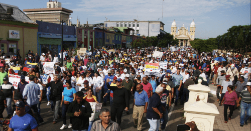 a group of people protesting in the street