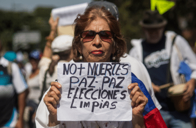 woman protestor holding up sign