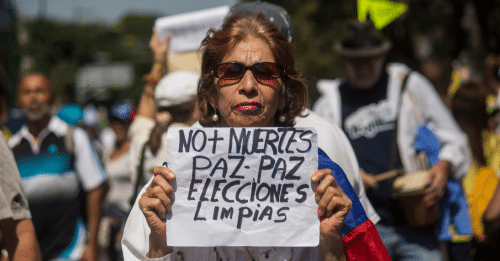 woman protestor holding up sign
