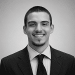 black and white headshot of man smiling