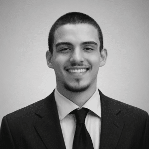 black and white headshot of man smiling