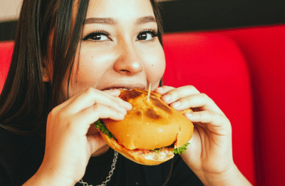 girl eating a burger