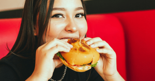 girl eating a burger