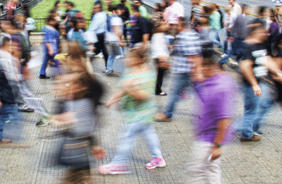 blurry people walking on the street
