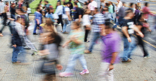 blurry people walking on the street