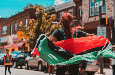 woman walking with flag