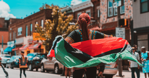 woman walking with flag