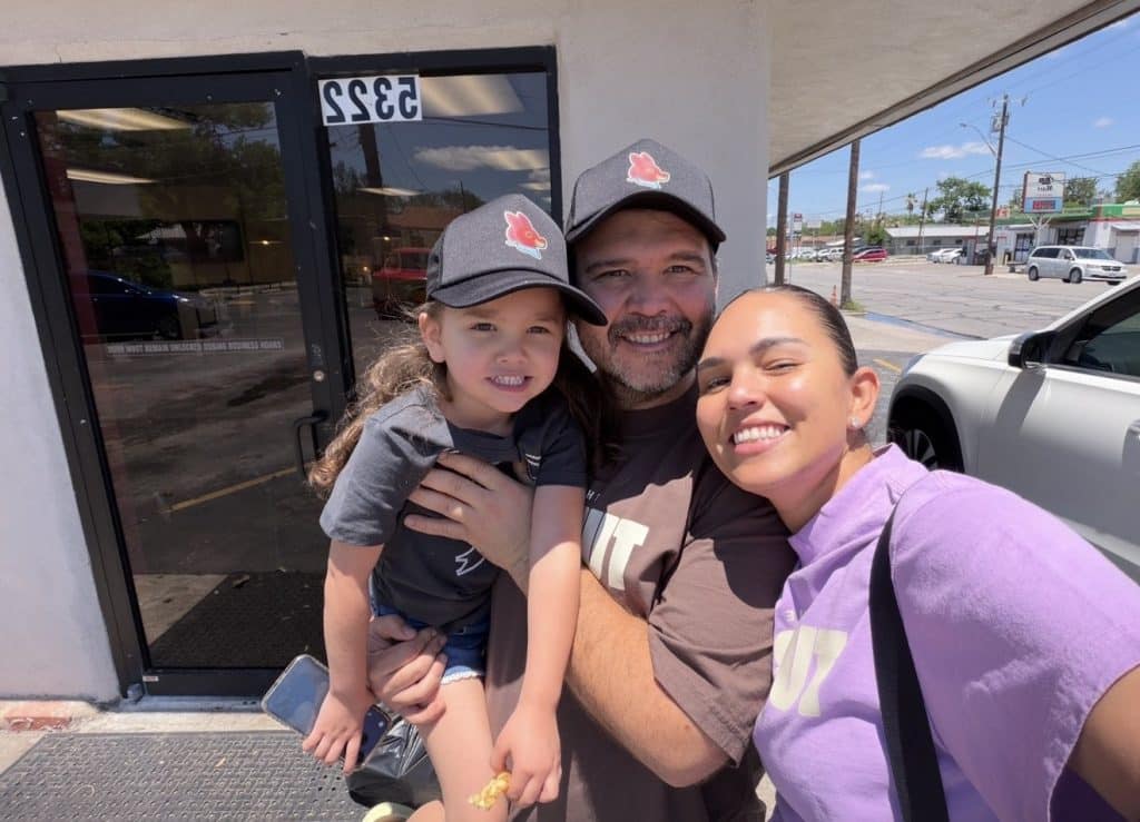 family taking a selfie smiling at the camera