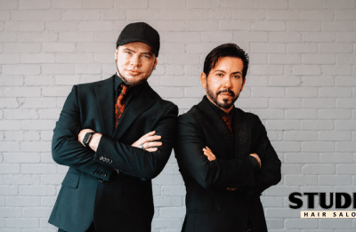 two men posing side by side