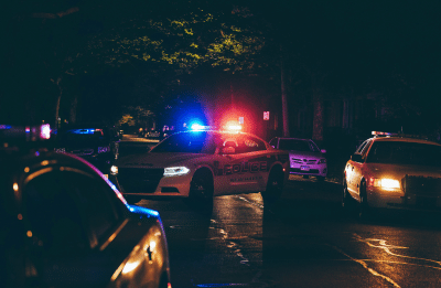 police cars on street at night