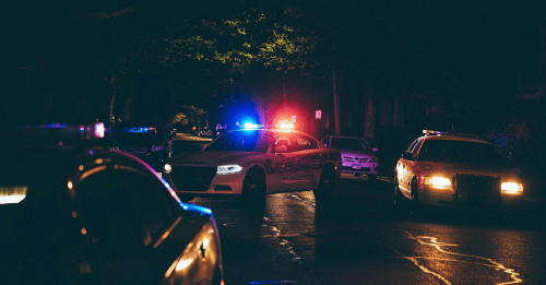 police cars on street at night